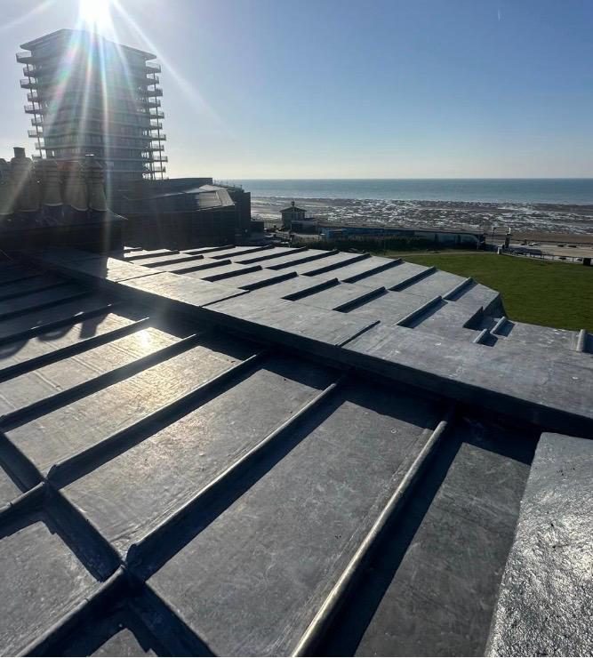 Sun catching a new lead roof above the Brighton seafront
